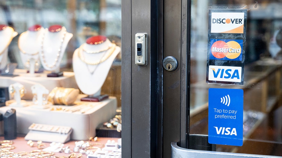 Signage for Mastercard, Visa and Discover credit cards