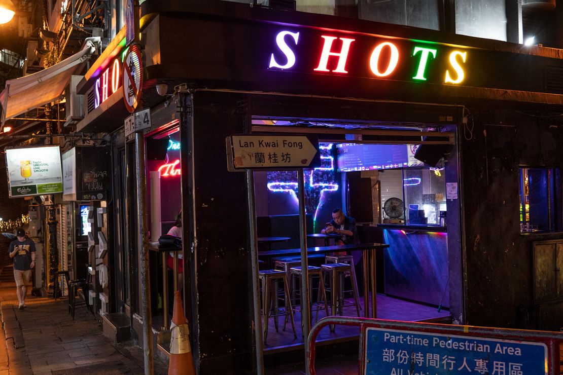 A man sits inside a bar in Lan Kwai Fong, Hong Kong's renowned nightlife hub.