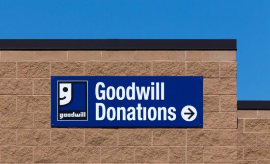 Top of a brick building with a sign that says "Goodwill Donations" and has the Goodwill logo in the left hand corner.